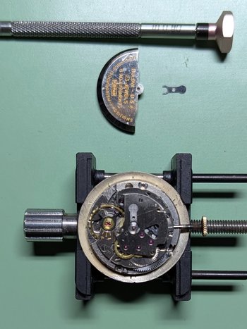 Removing the rotor and gib, revealing the automatic assembly. 